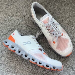 On Running White and Orange Sneakers